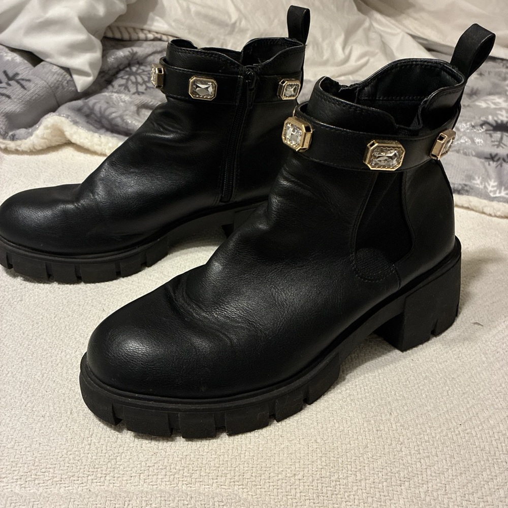 Chic Black Ankle Boots with Gold Accents